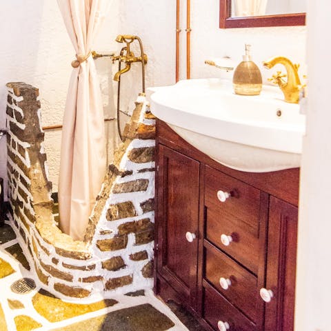 Freshen up in the wonderfully rustic, stone shower room