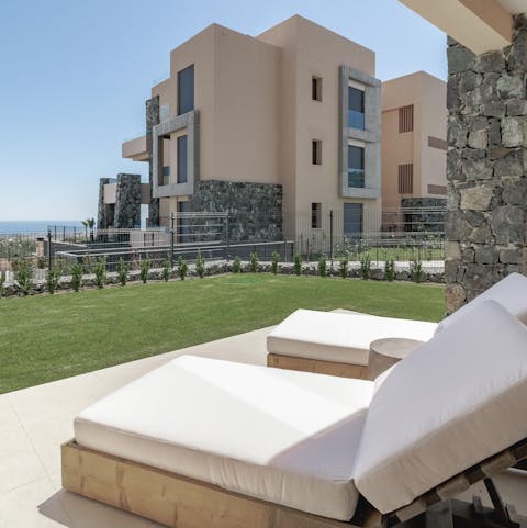 Relax on your comfy outdoor loungers while soaking up the Spanish sun