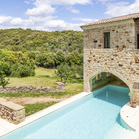 Wake up to views across the beautiful French countryside and spend a day by the pool