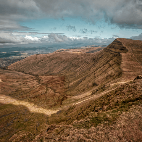 Head into the Brecon Beacons to climb the spectacular Pen Y Fan – it's an hour away