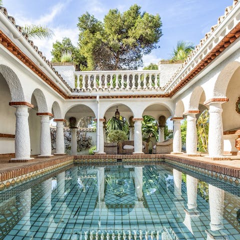 Go for a dip in the picturesque pool surrounded by authentic pillars