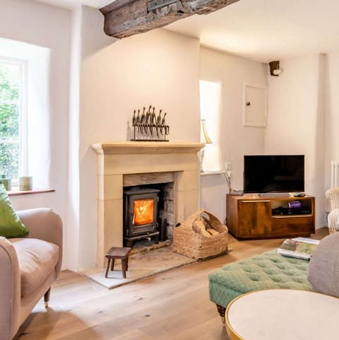 Cosy up in front of the log burner in the pretty living room