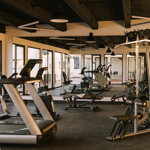 Work out with a city skyline view in the communal gym