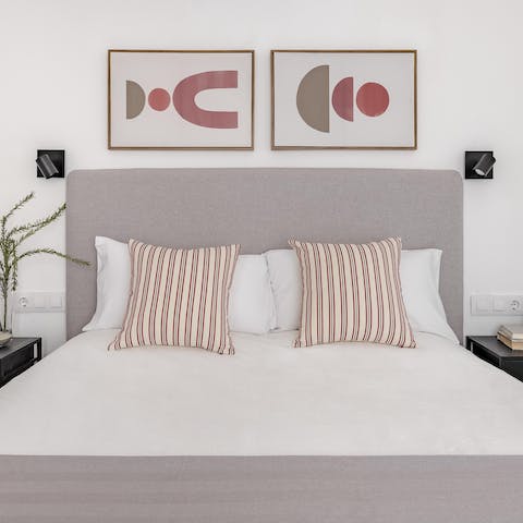Wake up in the stylish bedroom feeling rested and ready for another day of Madrid adventure
