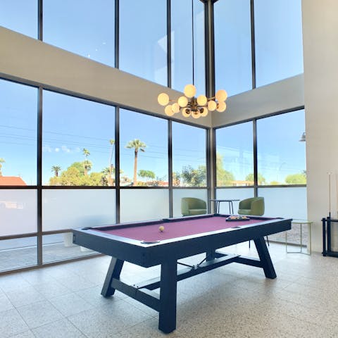 Play some pool in the shared lounge 