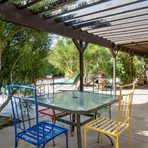 Gather everyone for a barbecue lunch under the pergola