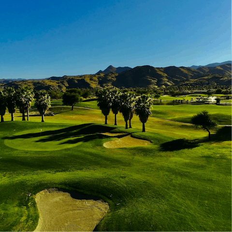 Spend a day on the green at your nearest golf course, a nine-minute drive from home