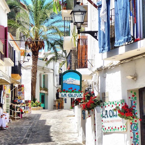 Take the thirty-three-minute drive and wander the cobbled streets of Ibiza Town