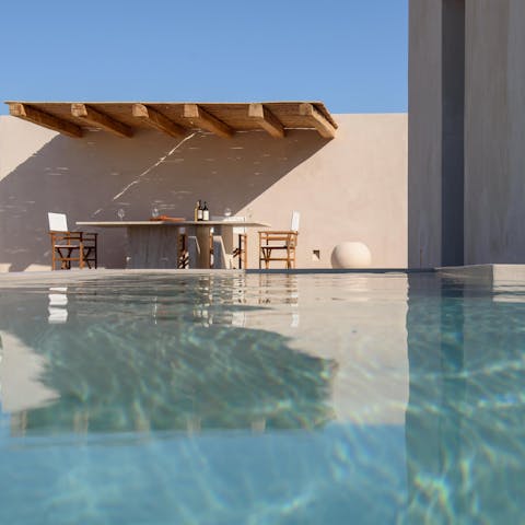 Swim laps in the huge swimming pool on the lower terrace