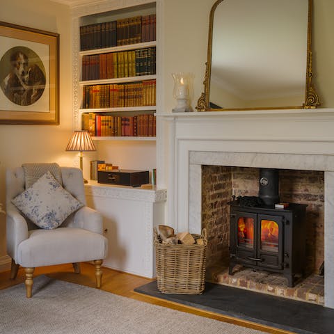 Cosy up around the fire in the elegant sitting room