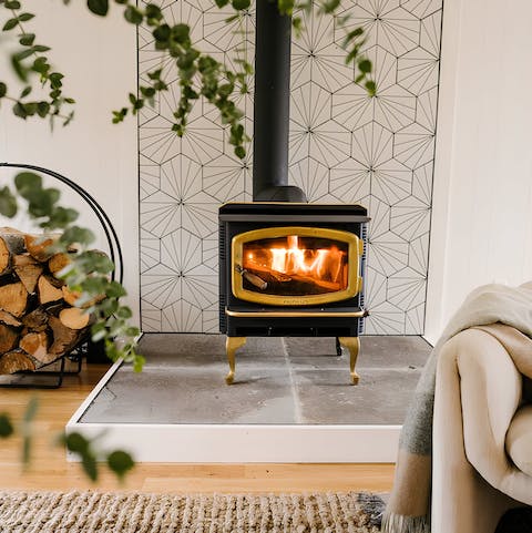 Curl up around the vintage wood-burner for a cosy night in