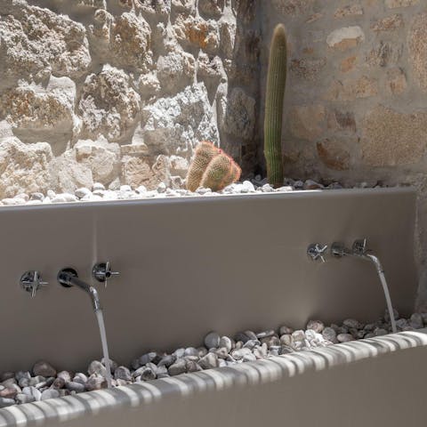 Feel at one with nature in the full outdoor bathrooms dotted with cacti