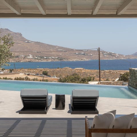 Swim laps in the infinity pool looking out over the coast and water