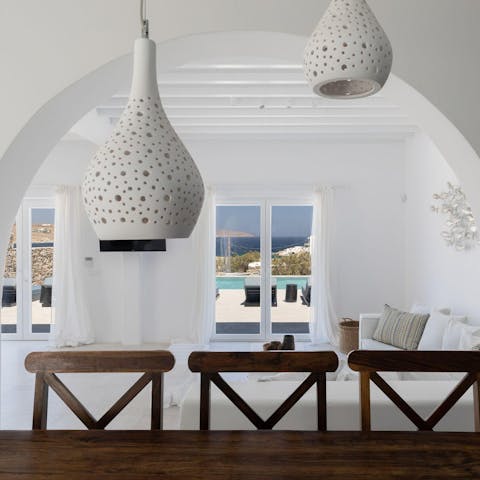 Admire the Cycladic touches inside – pure white and stone archways