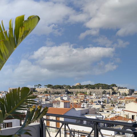 Look out to views of Rethymno old town from the building's rooftop terrace