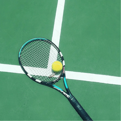 Play a game of tennis on the island's courts