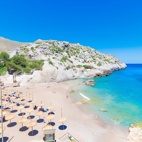Step into the turquoise sea at nearby Cala Barques beach