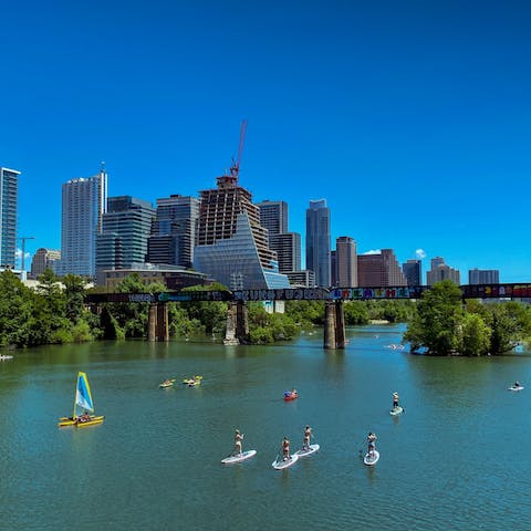 Enjoy kayaking and canoeing on Lady Bird Lake, an eight-minute drive from your door