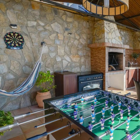 Challenge your loved ones to foosball, darts, or a table tennis match here