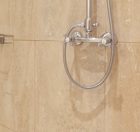 Scrub up in the elegant marble bathroom