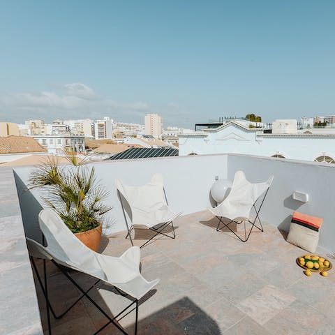 Catch some rays over a cool drink on the shared rooftop terrace