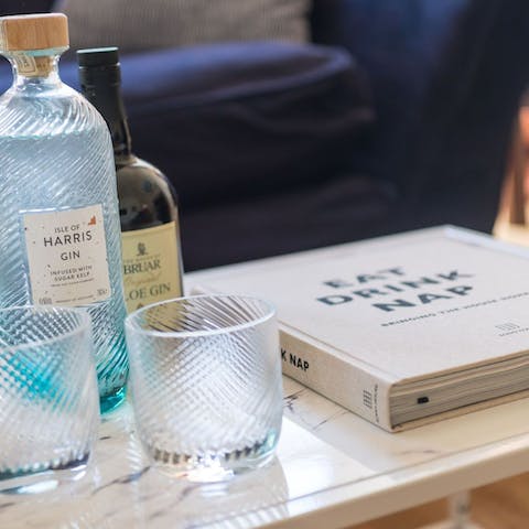 Pour a strong gin and tonic while you peruse some of the host's coffee table books