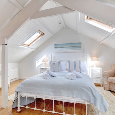 Drift off to sleep in the coastal-inspired bedroom at the end of a busy day