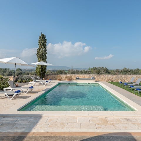 While away sun-kissed afternoons in the pool, admiring the rural scenery