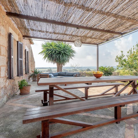 Enjoy a grilled dinner and Spanish wines on the terrace as the evening ends