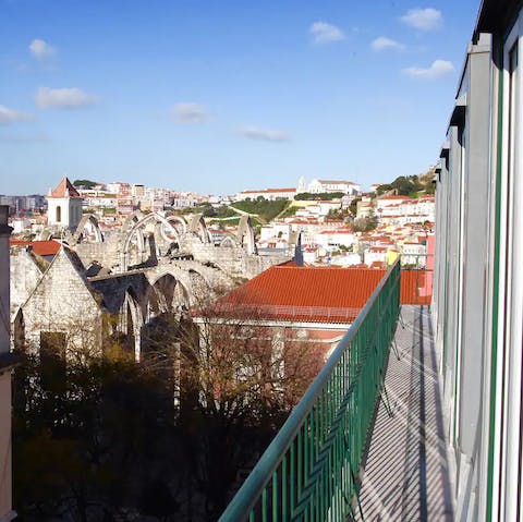 Step out onto the balcony and catch a glimpse of Castelo de S. Jorge in the distance