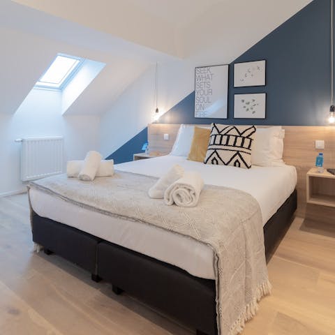 Wake up to rooftop views over Brussels through the bedrooms' skylight