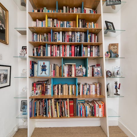 Thumb through the well-loved books that line the shelves throughout the home