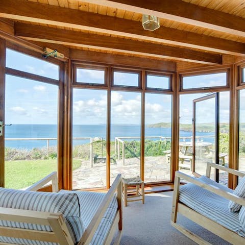 Read a book in the sun room – if you can keep yourself from gazing at the panoramic sea views 