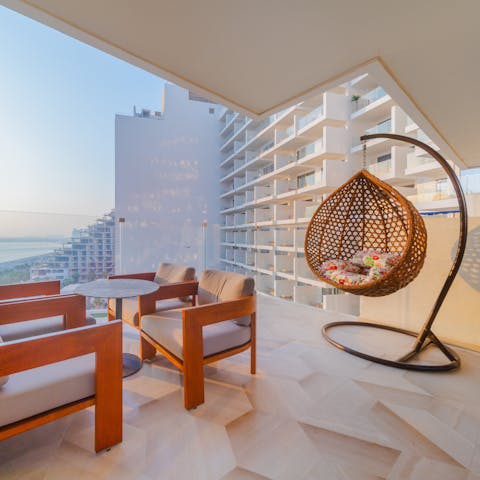 Relax in the hanging chair as you enjoy the sea view