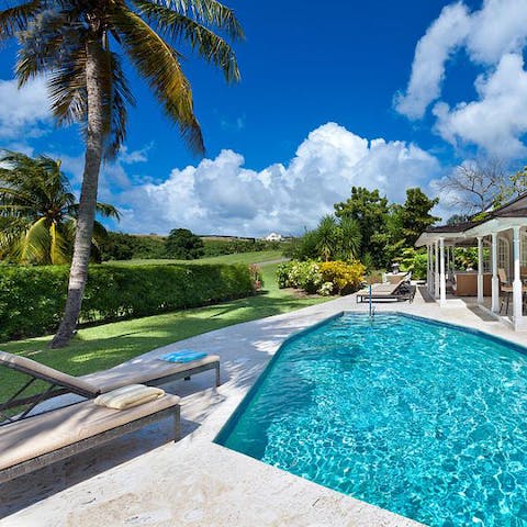 Cool off in your private pool as the breeze rustles through the palm trees
