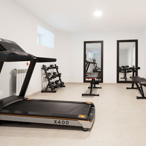 Stay on top of your fitness goals with the well-equipped communal gym