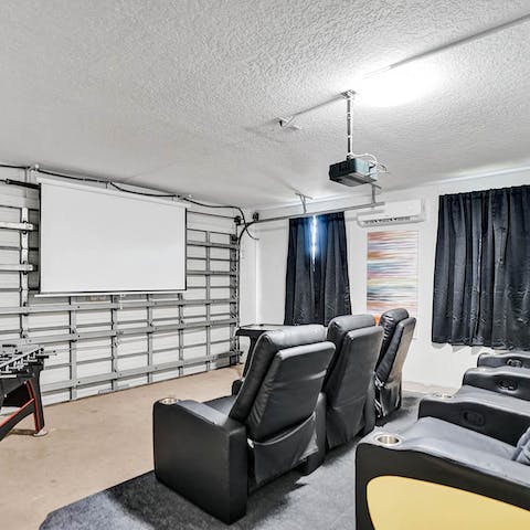 Get a movie night going in the home cinema and games room