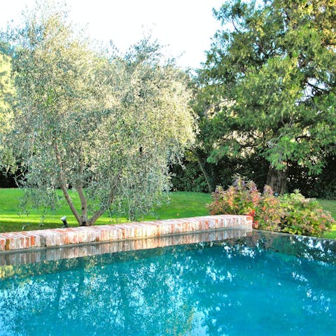 Slip into the private swimming pool and admire the gardens