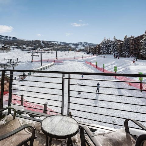 Watch as skiers whizz past your balcony 