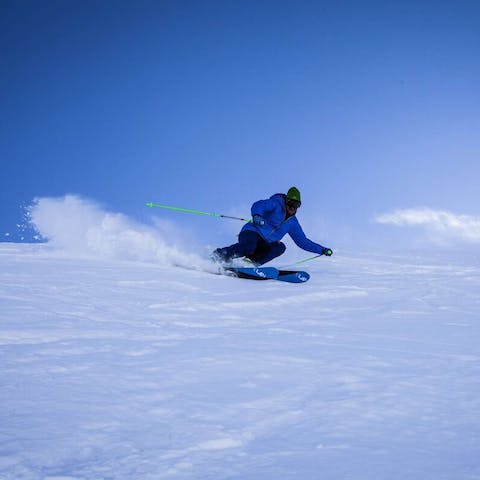 Play in the fresh powder on Snowmass Mountain