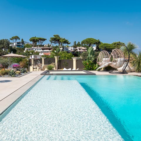 Slip seamlessly into the beach-style infinity pool