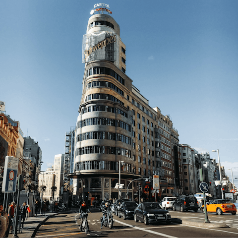 Stroll over to Gran Vía in ten minutes and gaze up at the eclectic architecture