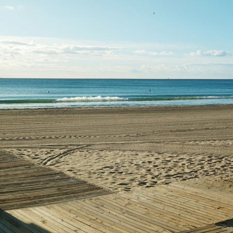 Sprawl out in the sand on Playa del Postiguet, 500m away