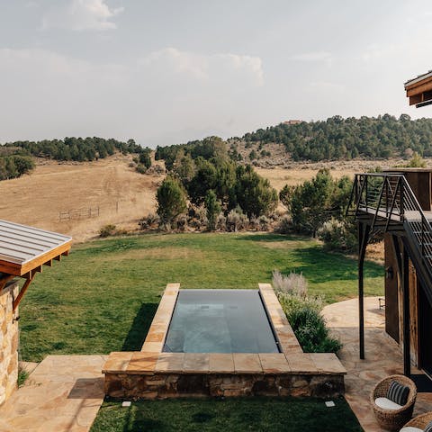 Dip in the infinity pool set into the expansive grasslands