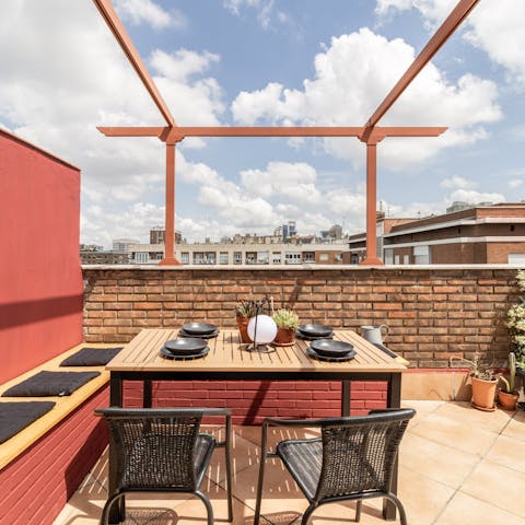 Dine alfresco on seafood paella on the private terrace