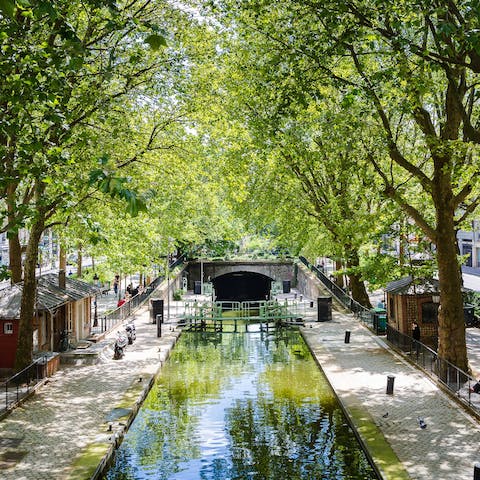 Enjoy refreshing strolls alongside Canal Saint-Martin