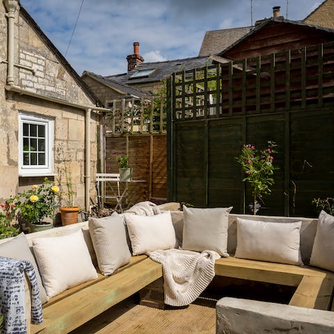 Relax on sunny days with a book on the deck in your back garden