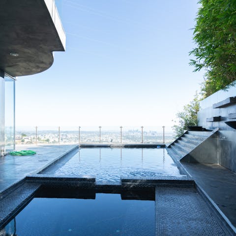 Swim each morning in the home's pool with epic views 