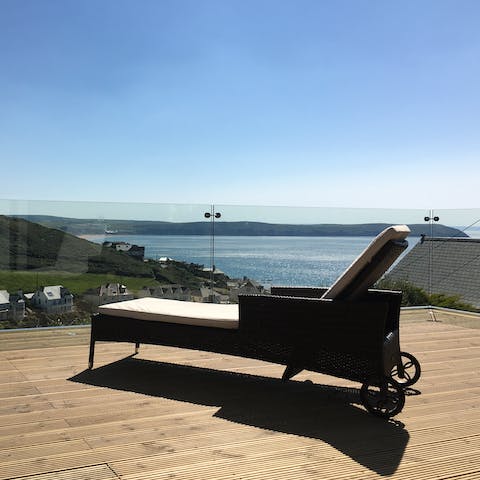 Lounge with a G&T on the deck chairs and admire the gorgeous views
