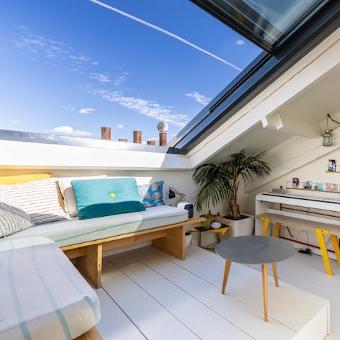 Open up the mezzanine snug's Velux skylight to catch some rays over a glass of wine